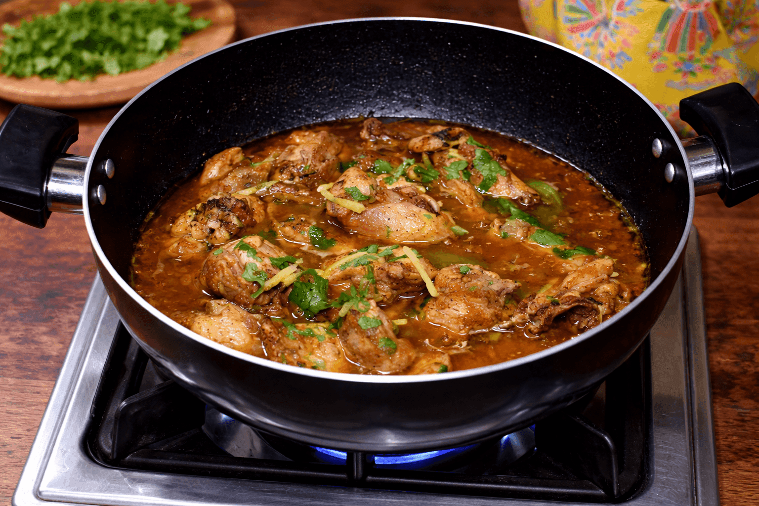 Bone-in chicken karahi with peeled tomato masala in a traditional wok