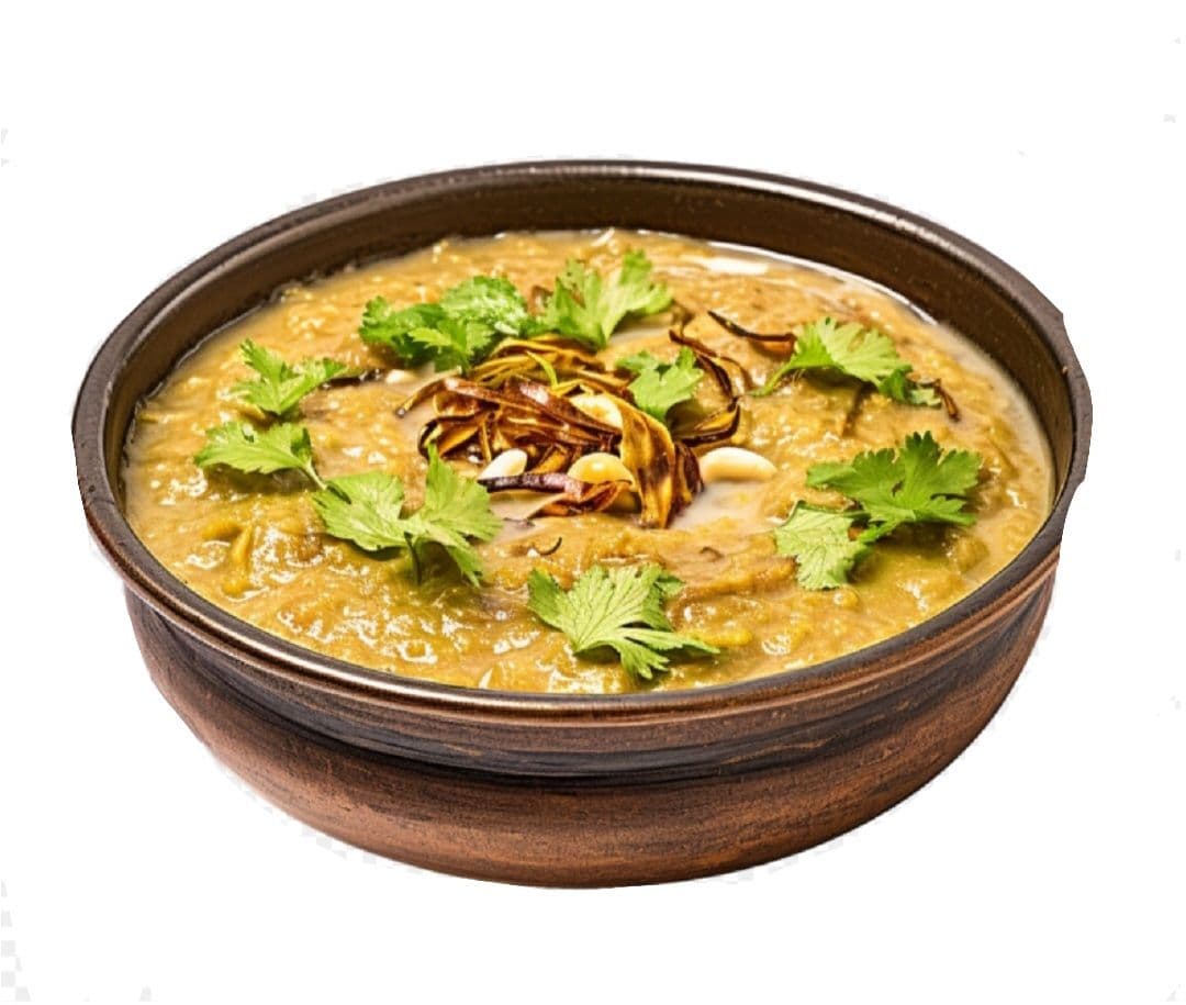 Royal Beef Daleem in a bowl garnished with fried onions, ginger, and fresh coriander