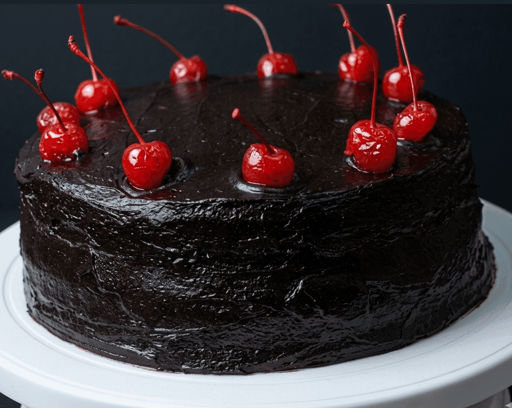 Eggless chocolate cake with dark ganache icing, made in a pressure cooker at home