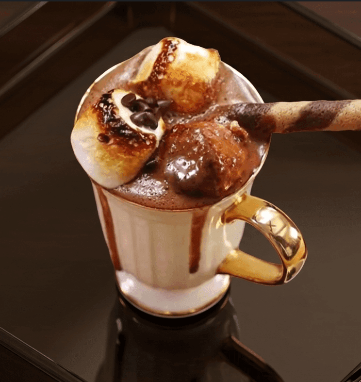 Sanjeev Kapoor's hot chocolate in a mug topped with marshmallows and chocolate chips