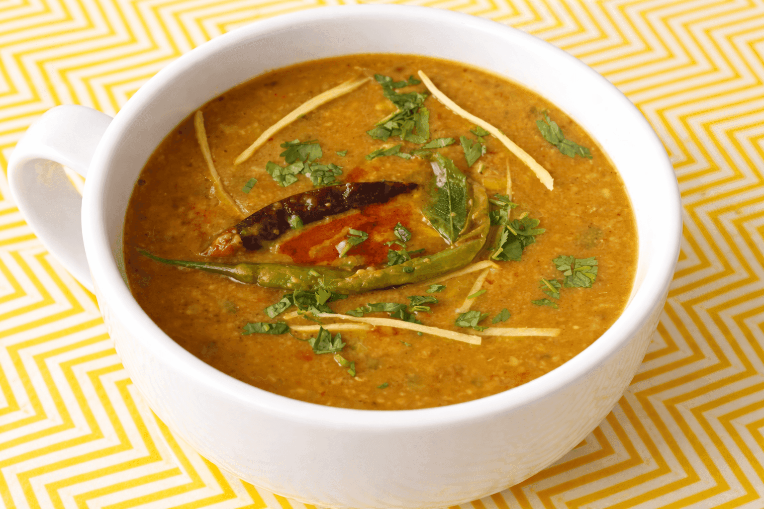 Panchmel Dal five-lentil mix in a bowl with smoky ghee tempering poured on top