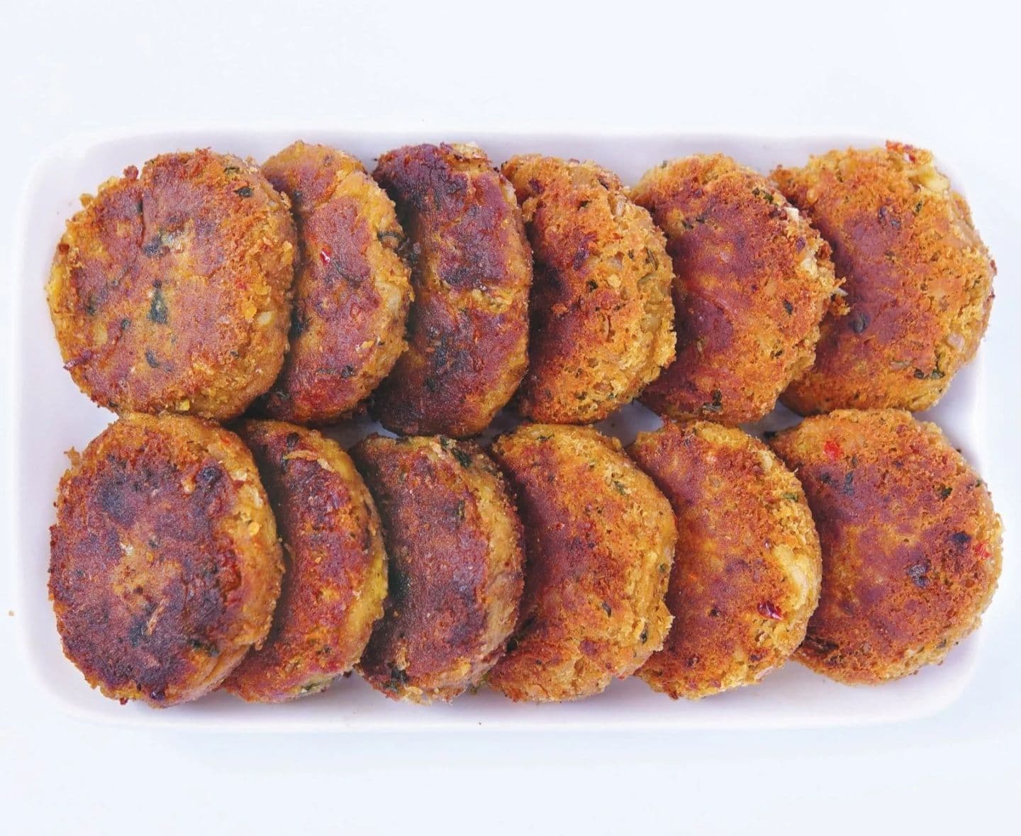 Crispy Shami Kabab patties made with boneless beef and chana dal on a serving plate
